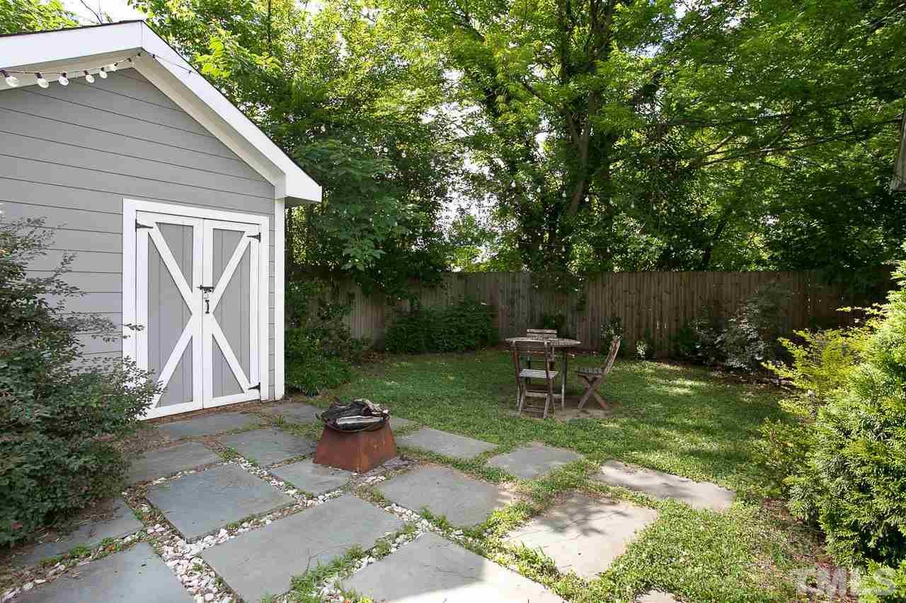 818 Ellington Street Raleigh, NC 27601 - Photo 20 of 20 a view of a chair and table in backyard of the house