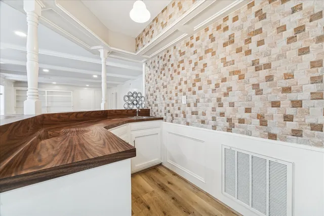 a bathroom with a granite countertop sink and a bathtub