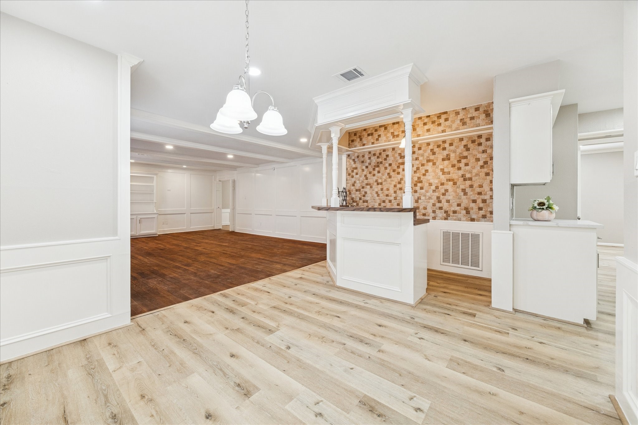 1502 Big Horn Drive Houston, TX 77090 - Photo 15 of 36 a view of a livingroom with wooden floor and a ceiling fan