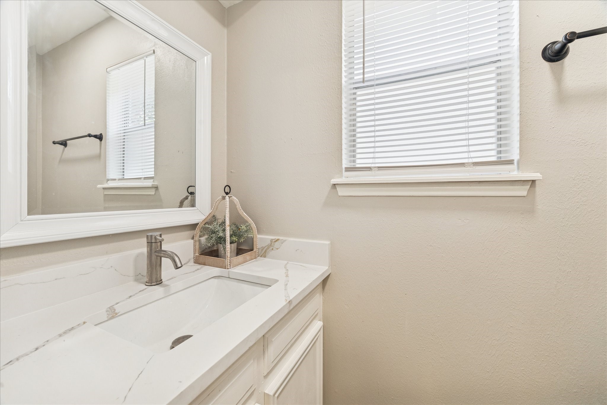 1502 Big Horn Drive Houston, TX 77090 - Photo 20 of 36 a bathroom with a sink and a mirror