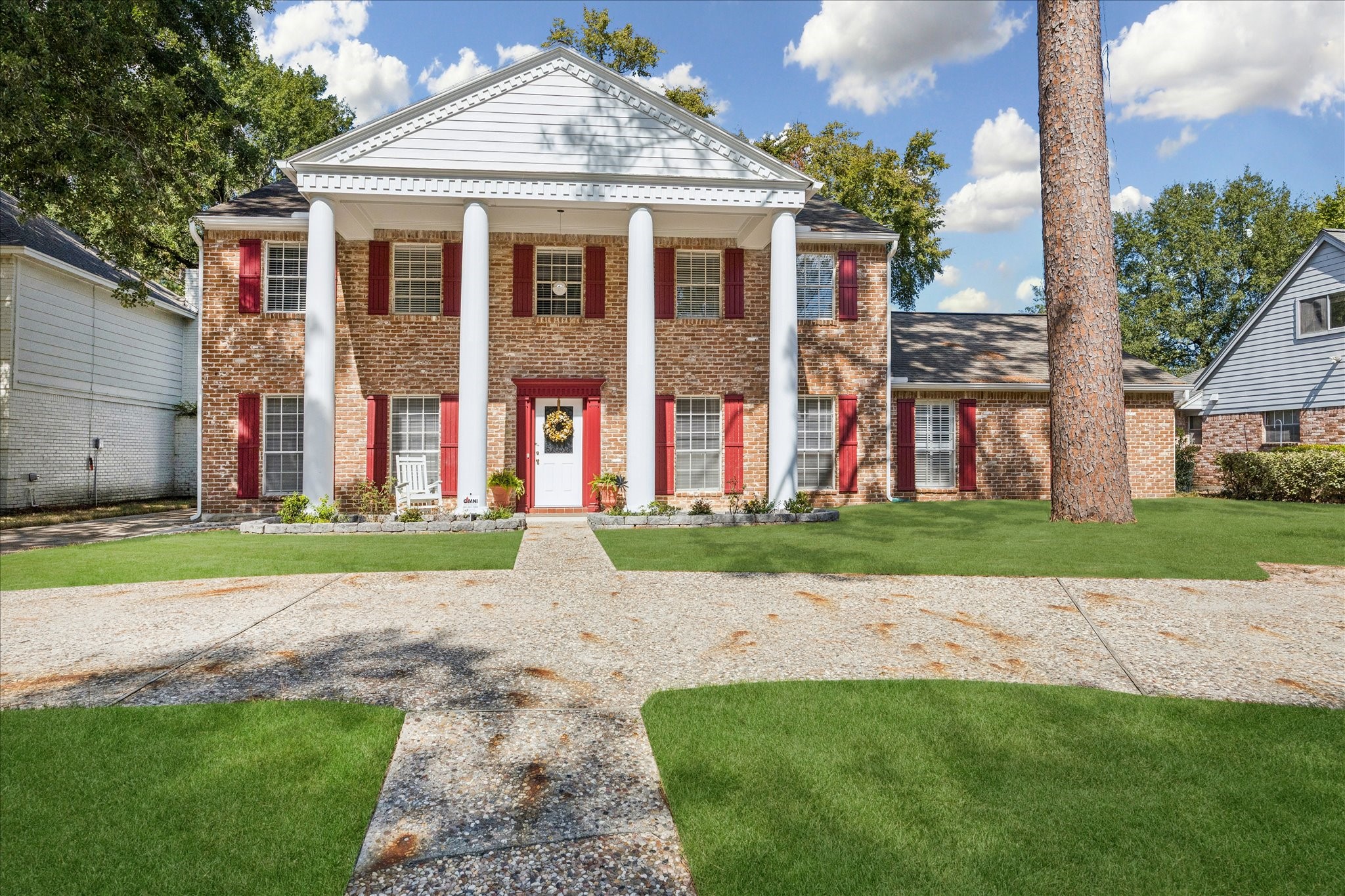 1502 Big Horn Drive Houston, TX 77090 - Photo 2 of 36 a front view of a house with a yard and road