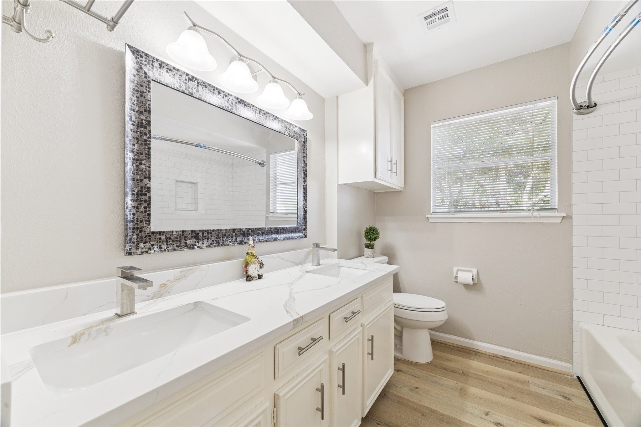 1502 Big Horn Drive Houston, TX 77090 - Photo 33 of 36 a bathroom with a sink and a mirror