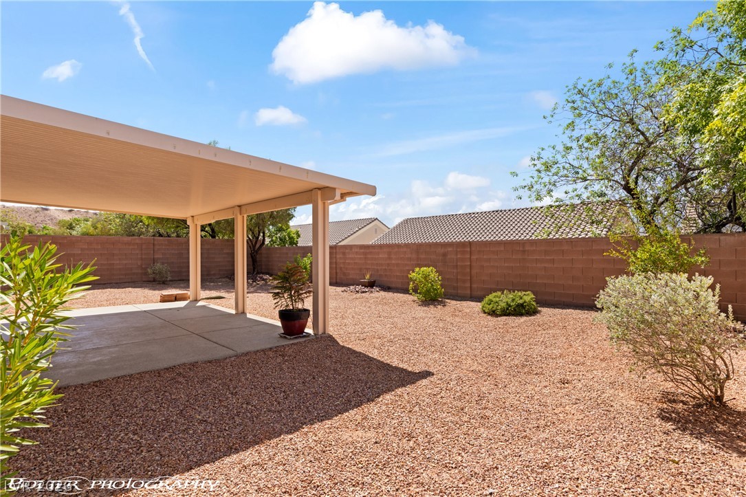 874 Glendale Road Mesquite, NV 89027 - Photo 57 of 71 A spacious backyard with a covered patio offers ideal outdoor living and privacy.