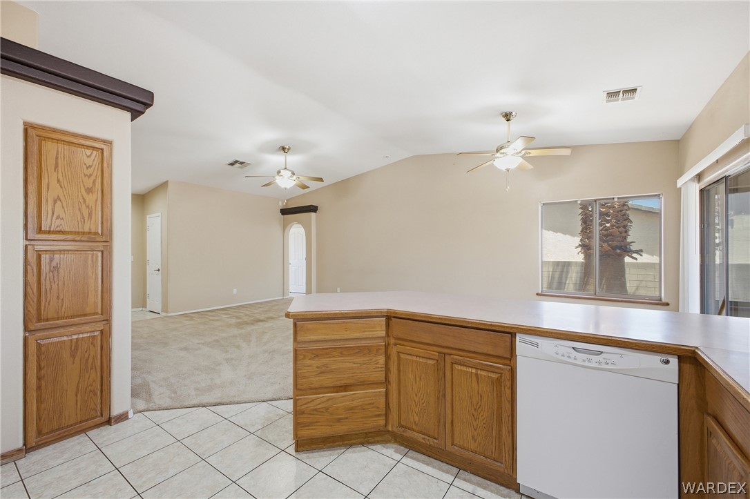3918 North Eagle Rock Road Kingman, AZ 86409 - Photo 9 of 44 a kitchen with granite countertop a cabinets and white appliances