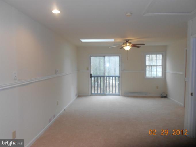 710 Planters Wharf Road Lusby, MD 20657 - Photo 12 of 16 a view of an empty room with a window