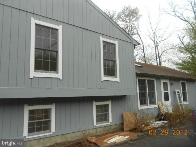 710 Planters Wharf Road Lusby, MD 20657 - Photo 16 of 16 a front view of a house with a yard
