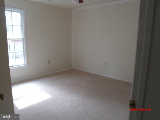 710 Planters Wharf Road Lusby, MD 20657 - Photo 3 of 16 an empty room with a window