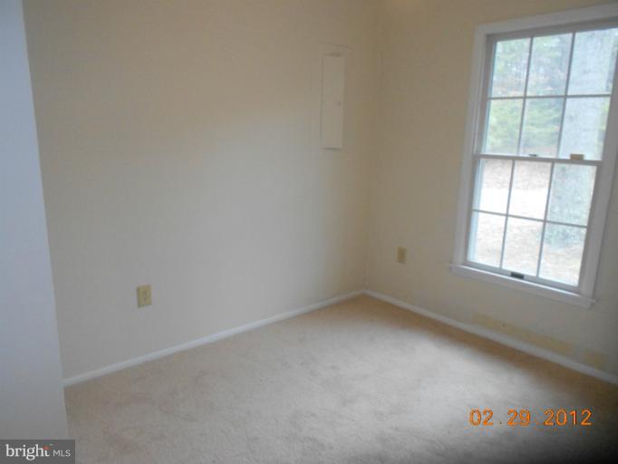 710 Planters Wharf Road Lusby, MD 20657 - Photo 5 of 16 an empty room with a window