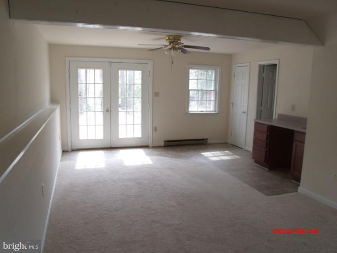 710 Planters Wharf Road Lusby, MD 20657 - Photo 6 of 16 an empty room with windows