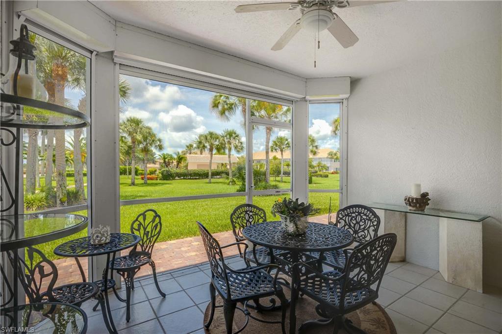 9022 Michael Circle, Unit 1 Naples, FL 34113 - Photo 22 of 29 a view of a dining room with furniture window and outside view