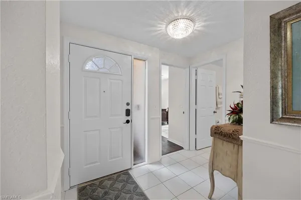 a view of a hallway to rooms