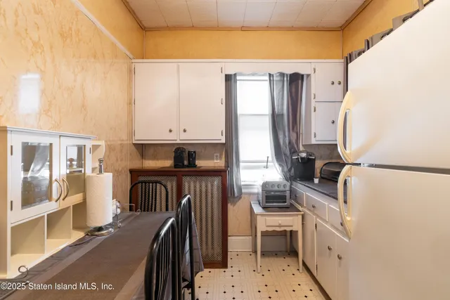 a kitchen with a sink appliances and cabinets