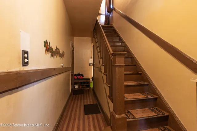 a view of entryway with wooden floor