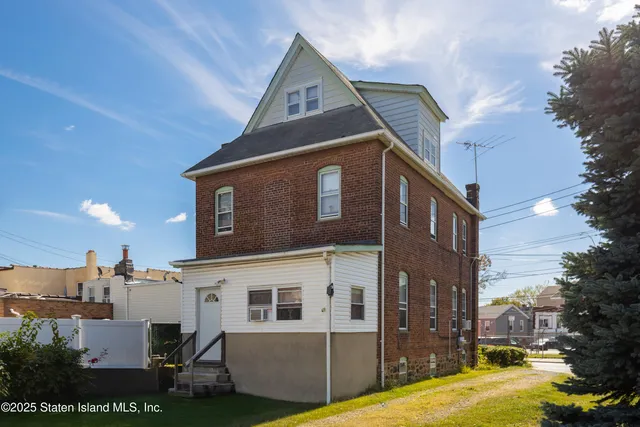 a front view of a house with stairs