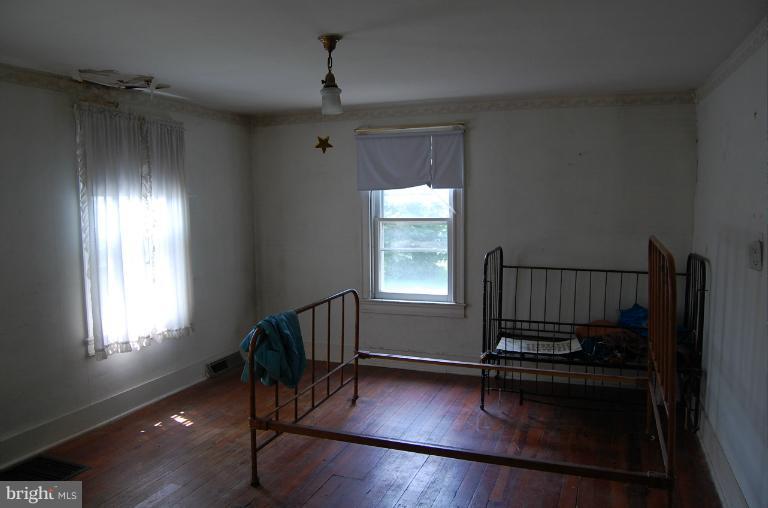 13508 Motters Station Road Rocky Ridge, MD 21778 - Photo 13 of 19 an empty room with windows
