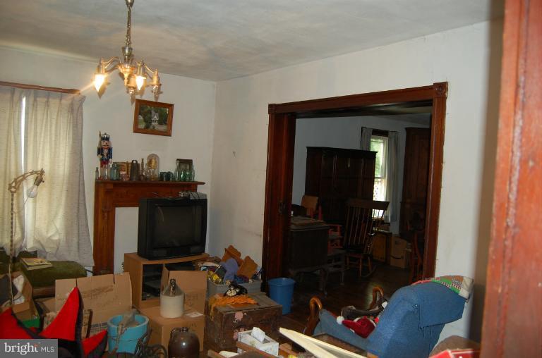13508 Motters Station Road Rocky Ridge, MD 21778 - Photo 15 of 19 a living room with furniture and a flat screen tv