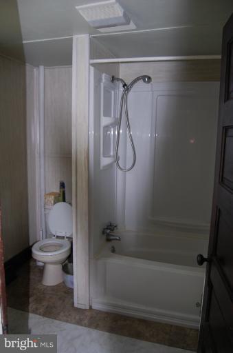 13508 Motters Station Road Rocky Ridge, MD 21778 - Photo 17 of 19 a bathroom with a shower and a toilet