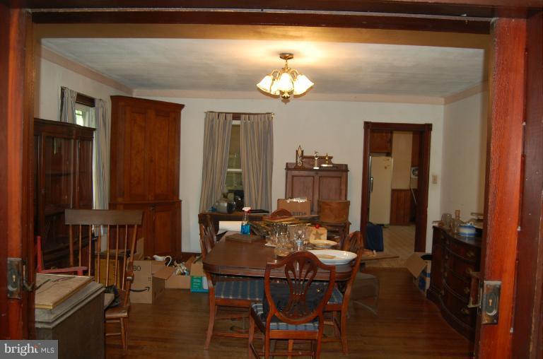 13508 Motters Station Road Rocky Ridge, MD 21778 - Photo 3 of 19 a view of a dining room with furniture and chandelier