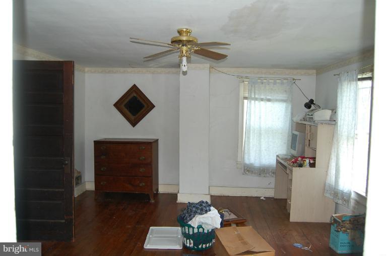 13508 Motters Station Road Rocky Ridge, MD 21778 - Photo 5 of 19 a front view of a house with wooden floor and a ceiling fan