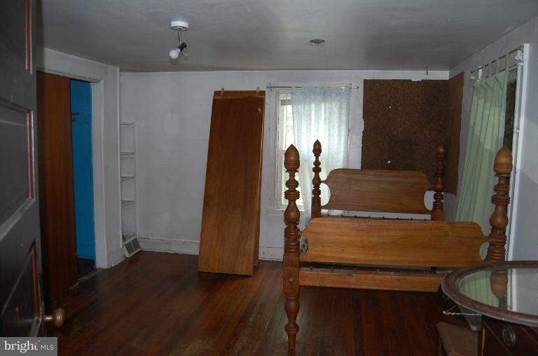 13508 Motters Station Road Rocky Ridge, MD 21778 - Photo 6 of 19 a dining room with furniture and wooden floor
