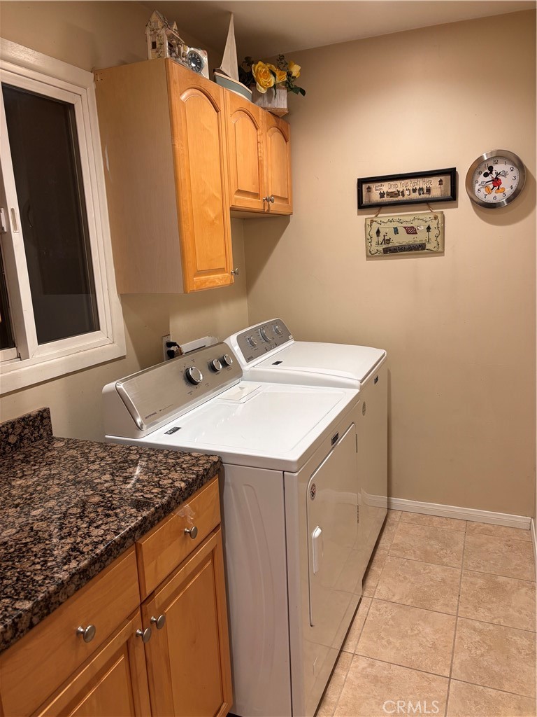 5604 Tower Road Riverside, CA 92506 - Photo 39 of 70 a utility room with a sink a washer and dryer