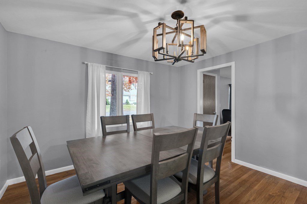 97 Hadley Street Springfield, MA 01118 - Photo 11 of 37 a view of a dining room with furniture window and wooden floor