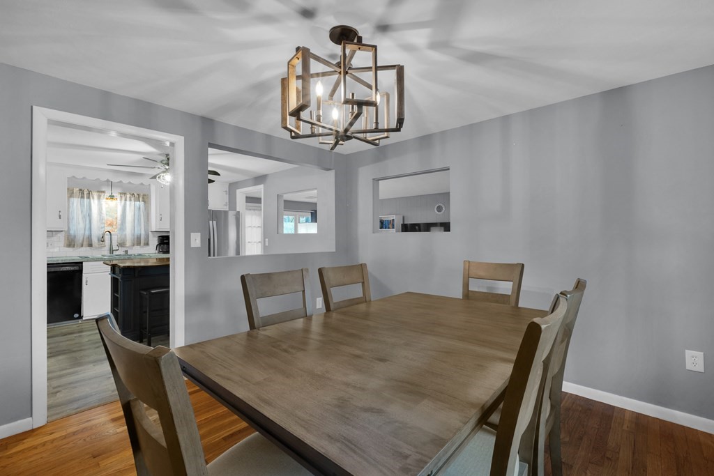 97 Hadley Street Springfield, MA 01118 - Photo 12 of 37 a view of a dining room with furniture and wooden floor