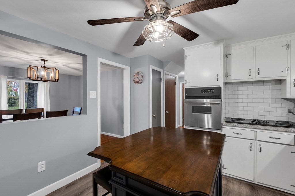 97 Hadley Street Springfield, MA 01118 - Photo 2 of 37 a kitchen with stainless steel appliances granite countertop a sink a stove and refrigerator