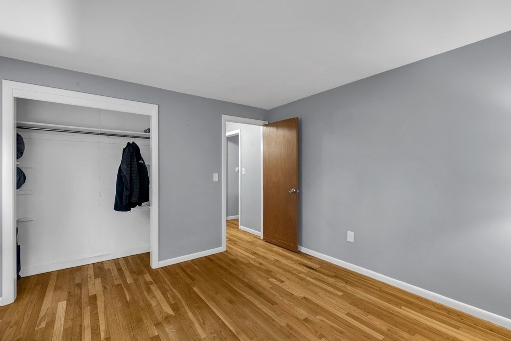 97 Hadley Street Springfield, MA 01118 - Photo 22 of 37 a view of walk in closet with clothes