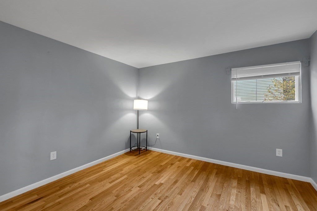 97 Hadley Street Springfield, MA 01118 - Photo 23 of 37 a view of empty room with wooden floor
