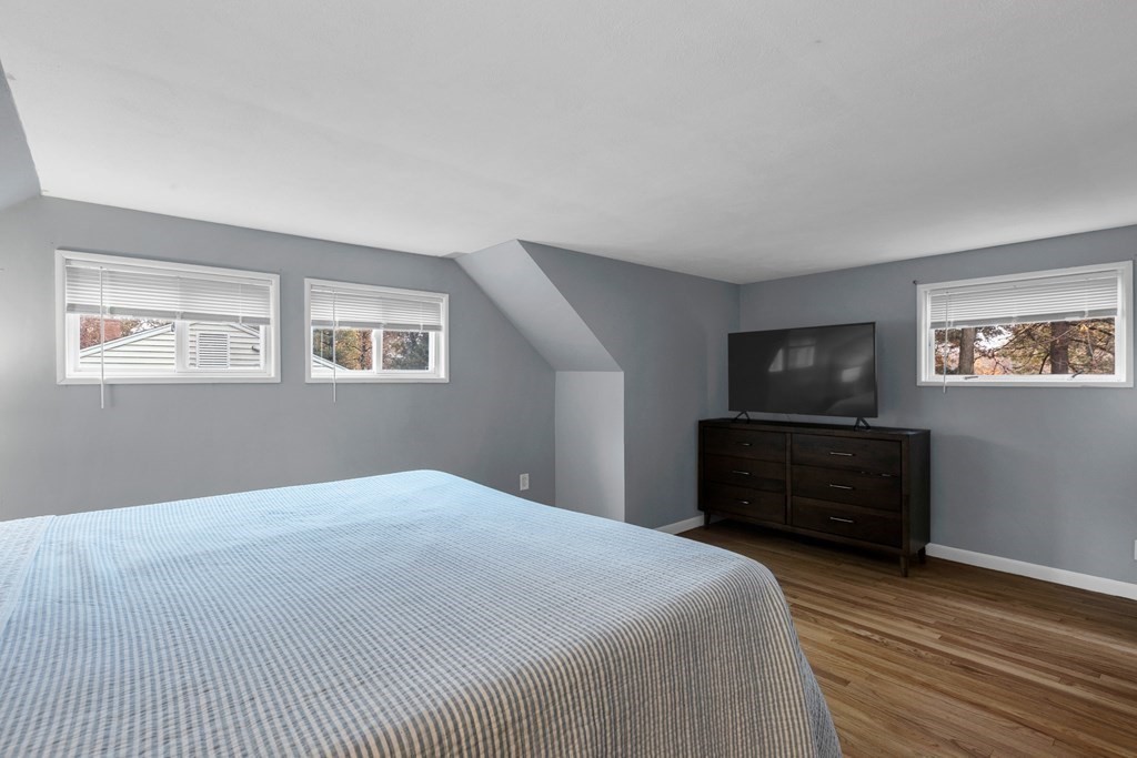 97 Hadley Street Springfield, MA 01118 - Photo 24 of 37 a bedroom with a bed dresser and a window