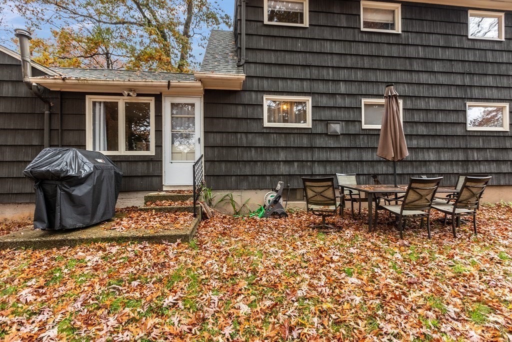 97 Hadley Street Springfield, MA 01118 - Photo 37 of 37 a backyard of a house with table and chairs