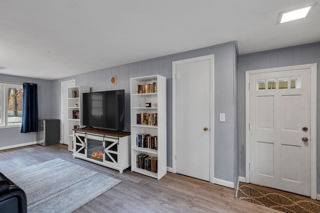 97 Hadley Street Springfield, MA 01118 - Photo 7 of 37 a living room with furniture and a flat screen tv