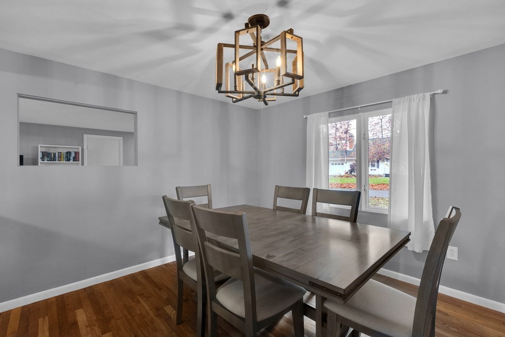 97 Hadley Street Springfield, MA 01118 - Photo 10 of 37 a view of a dining room with furniture window and wooden floor