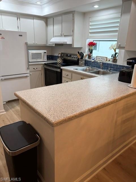 5 High Point Circle West, Unit 206 Naples, FL 34103 - Photo 39 of 39 a kitchen with stainless steel appliances granite countertop a sink stove and refrigerator