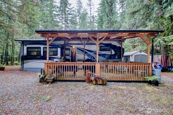 front view of a house with wooden fence