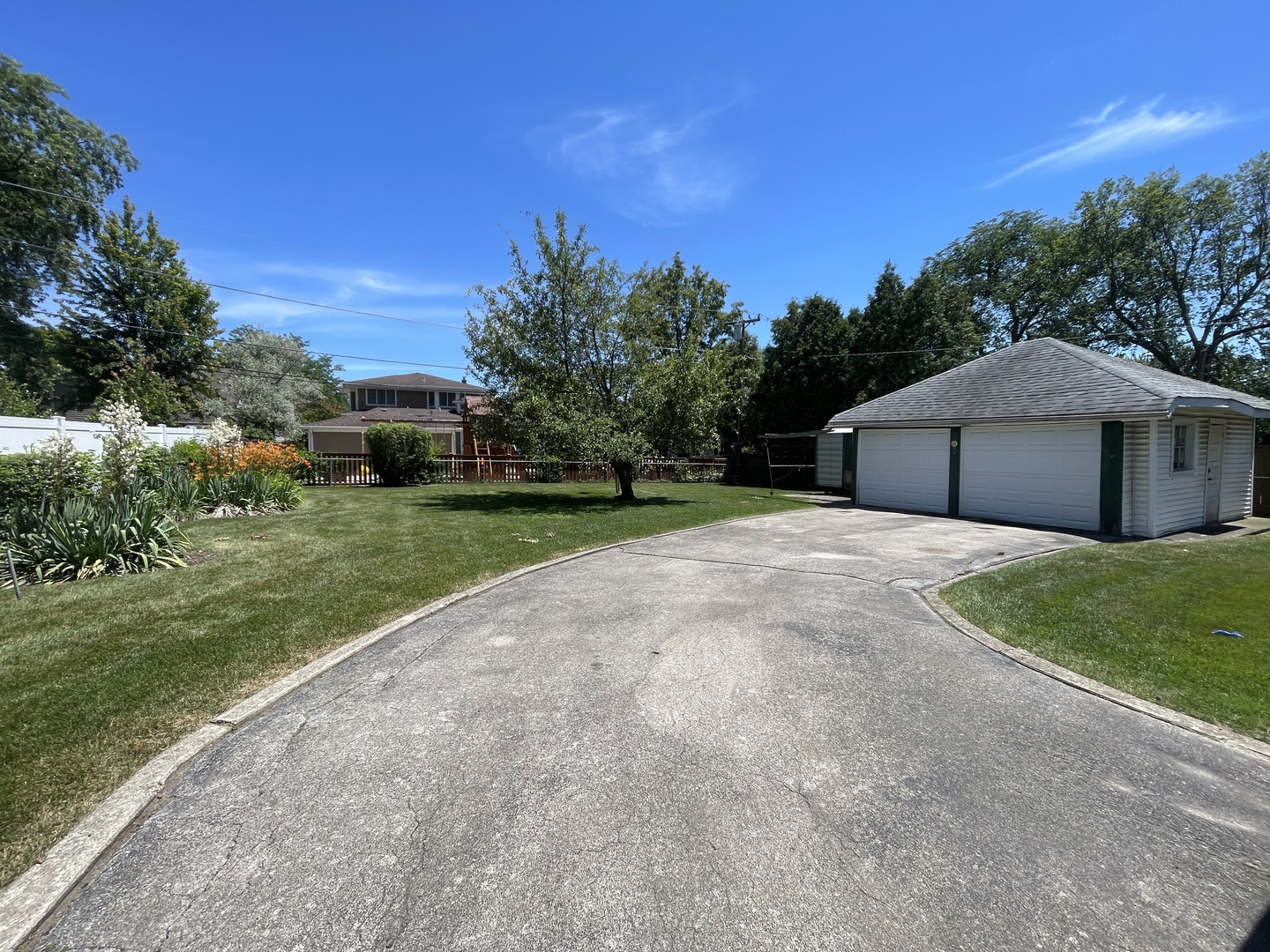 241 Oak Street Elmhurst, IL 60126 - Photo 3 of 4 a house with trees in the background