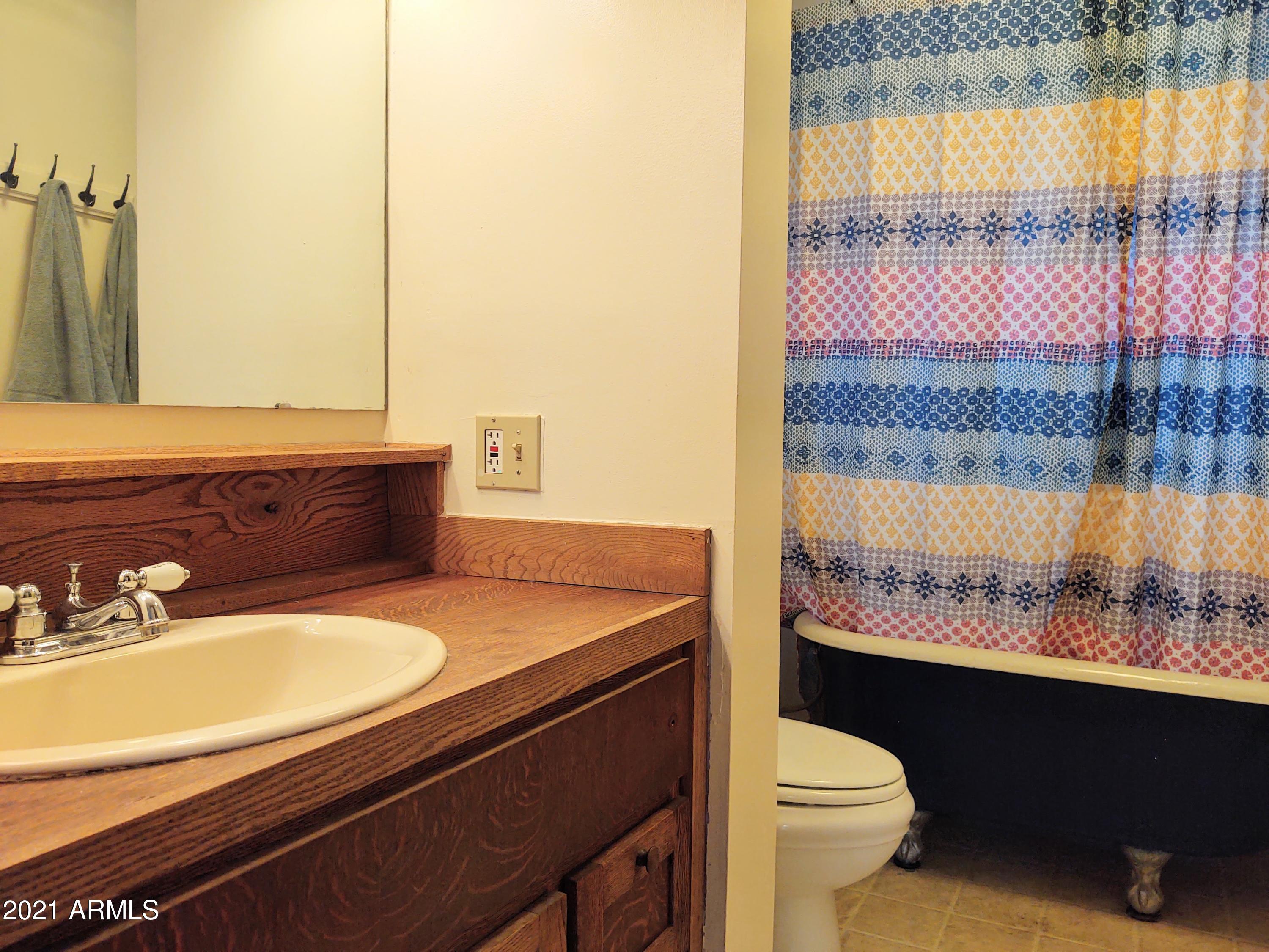 32 Old Douglas Road Bisbee, AZ 85603 - Photo 11 of 16 a bathroom with a sink and a toilet