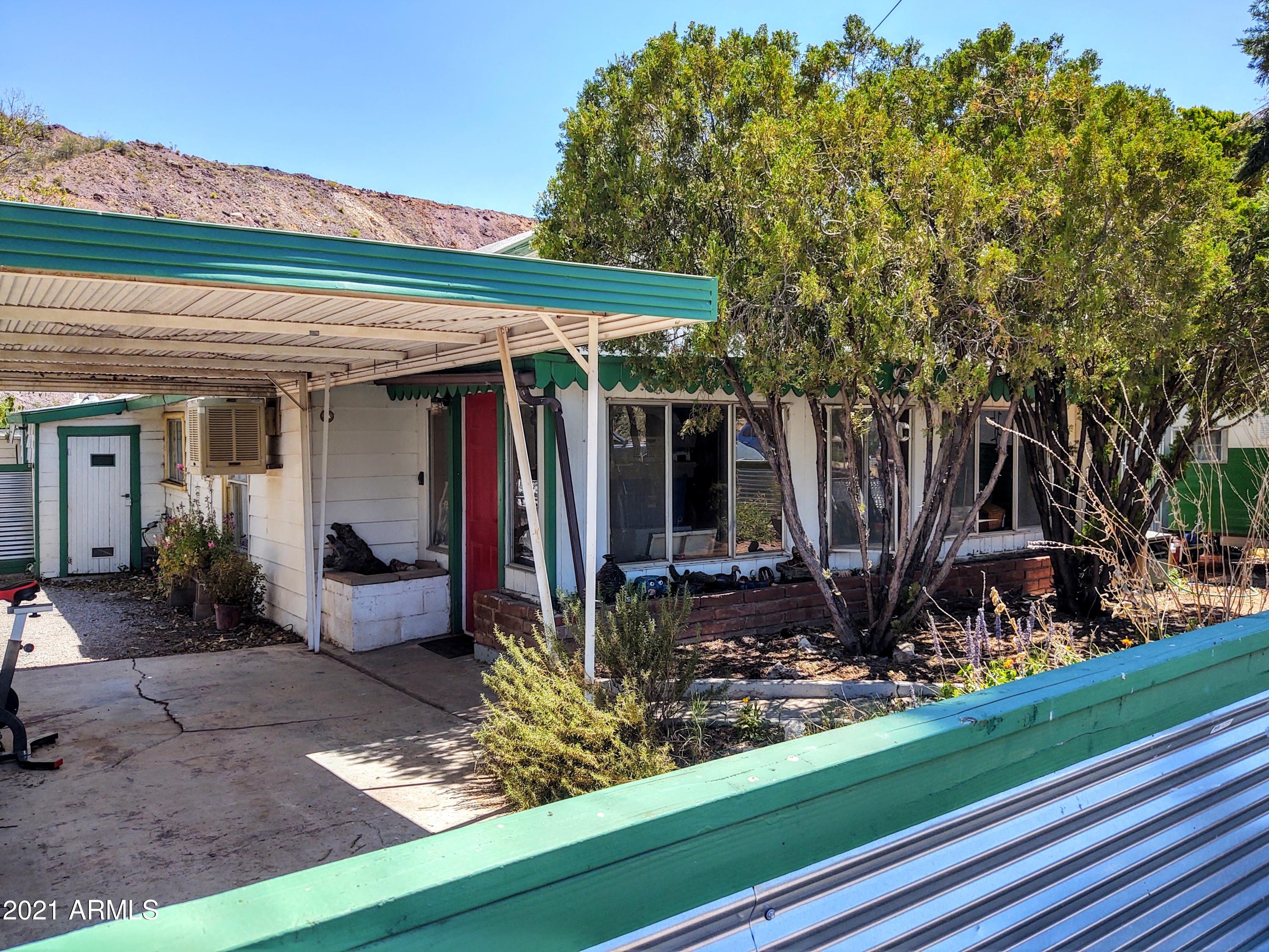 32 Old Douglas Road Bisbee, AZ 85603 - Photo 16 of 16 a front view of a house with garden