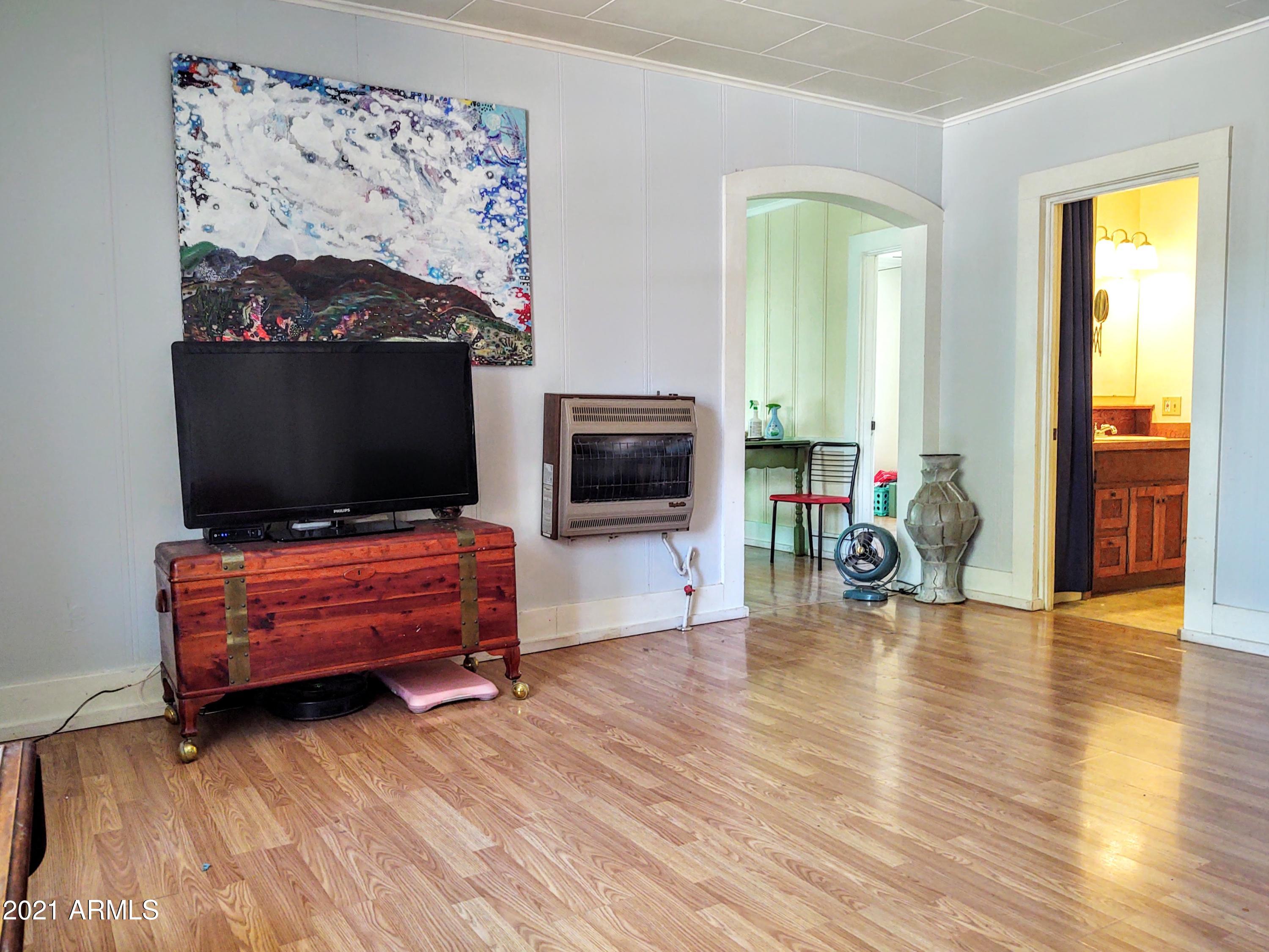 32 Old Douglas Road Bisbee, AZ 85603 - Photo 3 of 16 a living room with furniture and a flat screen tv