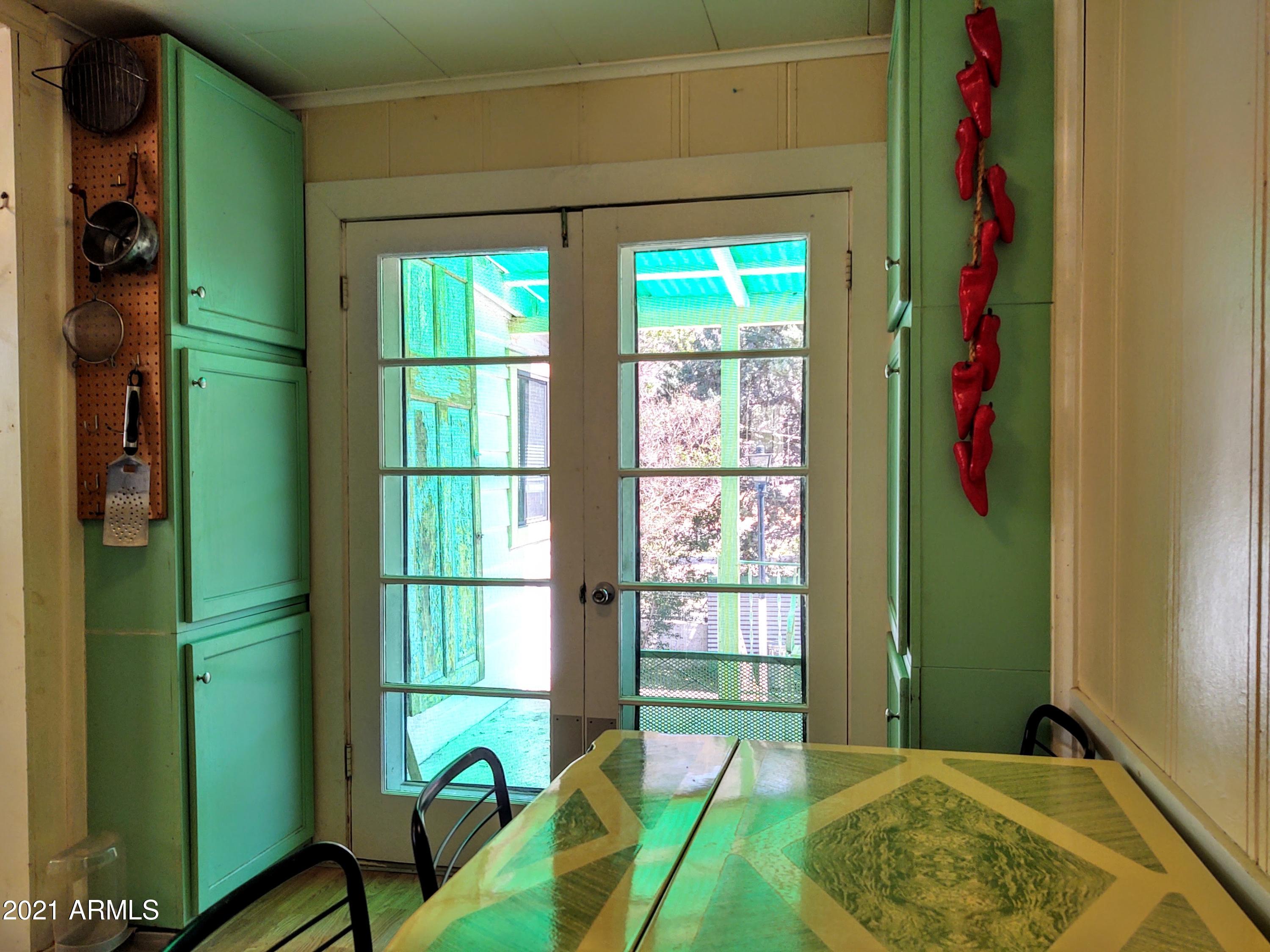 32 Old Douglas Road Bisbee, AZ 85603 - Photo 7 of 16 a bedroom with a bed and a window
