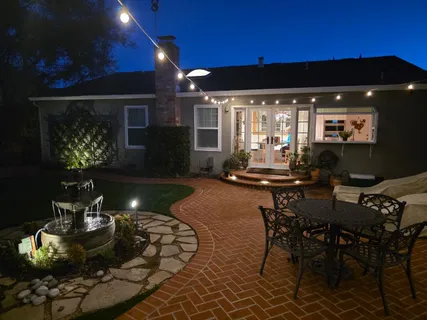 a outdoor living space with furniture and a fireplace