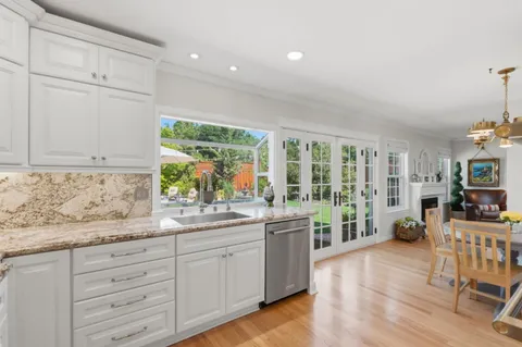 a kitchen with sink and cabinets