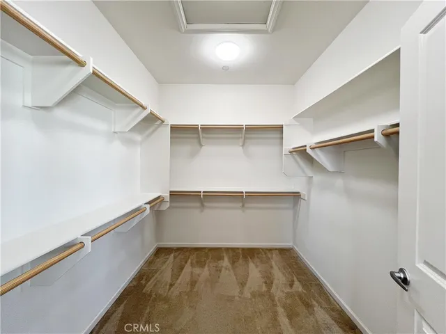 a view of an empty walk in closet