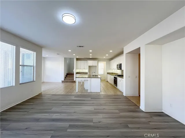a view of kitchen dining table kitchen appliances and a window
