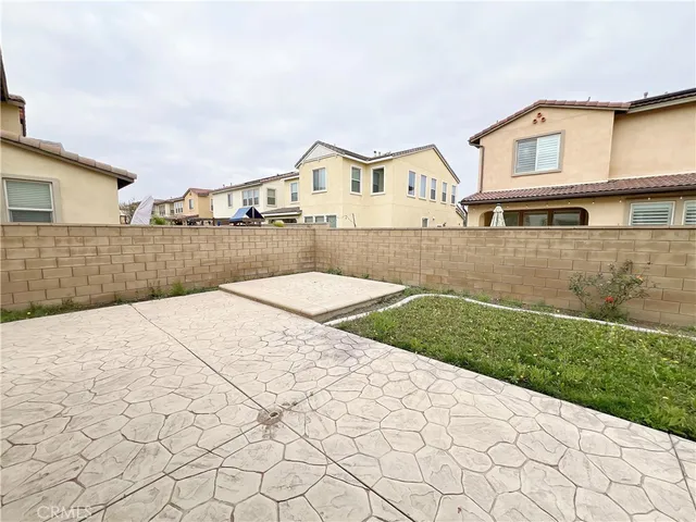 a view of a white house with a yard