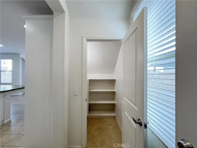 a view of an empty room and a window