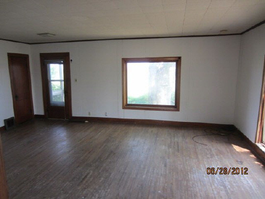 29369 Lukens Road Sycamore, IL 60178 - Photo 4 of 10 an empty room with wooden floor and windows