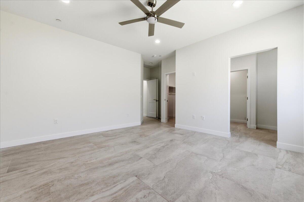 68160 Modalo Road Cathedral City, CA 92234 - Photo 16 of 57 an empty room with fan and hallway