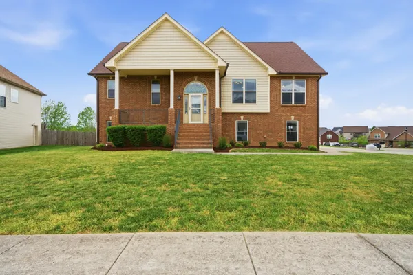 a front view of a house with garden